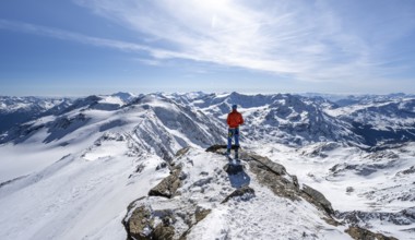 Ski tourer at the summit of Monte Cevedale, looking into the distance, mountain panorama,