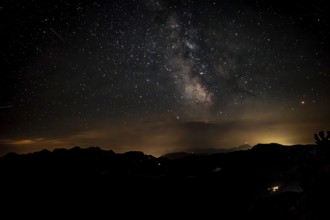 Starry sky with the Milky Way over the Chiemgau Alps, view towards Loferer Steinberge and