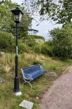 Bench and lantern in the famous allotment garden colony of Brändaholm on the island of Dragsö in