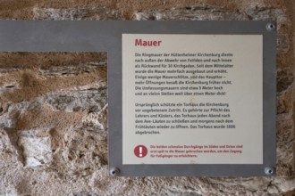 Information board about the curtain wall of the fortified church, Hüttenheim, Lower Franconia,