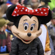 Person masked as Mickey Mouse at the carnival parade of the Wey guild on Rose Monday, Güdismäntig,