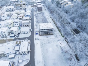 Winter scene of a residential area with trees, houses and snow-covered streets, Nagold, Black