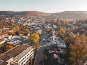 Urban landscape in sunlight, surrounded by hills and autumnal colours, Nagold, Black Forest,