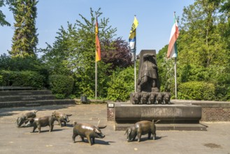 The pig fountain in the town of Zons, Dormagen, Lower Rhine, North Rhine-Westphalia, Germany,