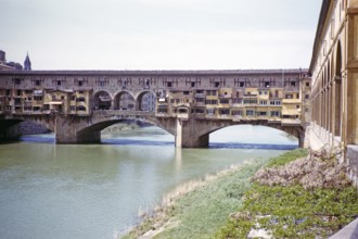 Famous bridge of the Ponte Vecchio, river Arno, Florence, Tuscany, Italy 1957