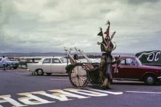 Rickshaw boy, African man taking a white woman in a rickshaw, Cape Town, South Africa 1960s