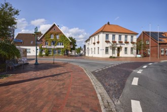 Town hall, flagpoles, pharmacy at the town hall, blue sky, intersection of Bohlenberger Straße with