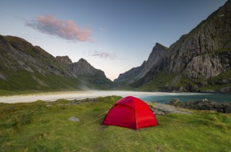 Red tent on Horseid beach, sandy beach with mountains, Lofoten, Norway, Europe