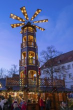 Large Christmas pyramid at the Christmas market at dusk, Lüneburg, Lower Saxony, Germany, Europe