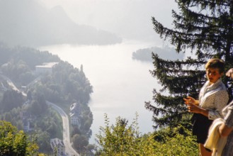 People looking down at lakeside villa owned by Marshal Tito, Lake Bled, Slovenia, former