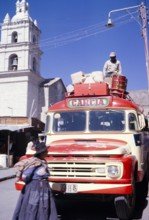 Local bus, red Ford with luggage on the roof, Ayacucho, Peru, South America 1962, South America