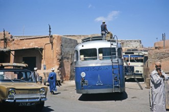 Buses and cars in a narrow street, Marrakech, Morocco, North Africa 1971, Africa