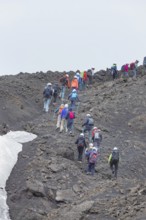 Group of hikers walking up to Mount Etna summit, Etna, Sicily, Italy, Europe