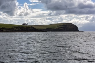 Coastline with lighthouse on cliff, Dingle Bay, Dingle Peninsula, County Kerry, Slea Head Drive,