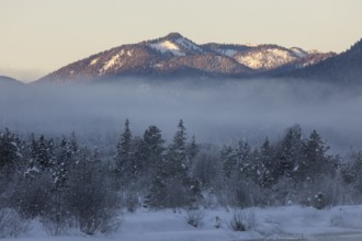 Isar valley in winter at temperatures of minus 18 degrees Celsius. Snow covered landscape with the