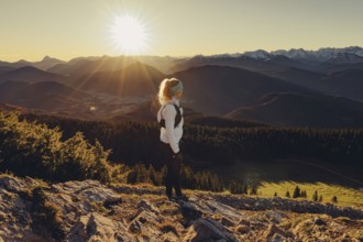 Trail running in autumn on the Jochberg on Lake Walchensee against the wonderful backdrop of the