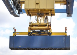 Duisburg, North Rhine-Westphalia, Germany, containers are loaded onto a goods train in the port of