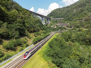 Railway passenger train of the type Stadler Flirt of the Südostbahn on the Gotthard railway Aerial