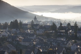 Village in a misty hilly landscape at dawn, Korb im Remstal, Baden-Württemberg, Germany, Europe