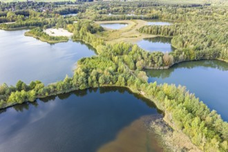 Artificial lake left after gravel mining, Lüneburger Heide near Celle, Germany, Europe