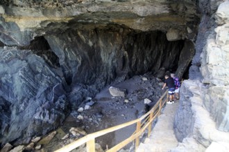 People exploring the sea caves at Ajuy, Fuerteventura, Canary Islands, Spain, Europe