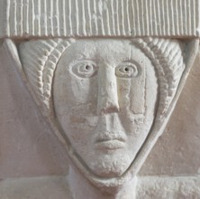 Stonework carved head of woman, church of Saint Michael, Yanworth, Gloucestershire, England, UK