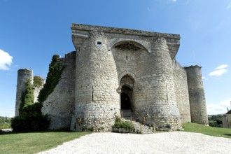 Billy. The entrance to a historic fortified castle, showcases medieval architecture from the 13th