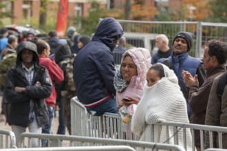 Refugees from Syria waiting to be registered at the Central Reception Centre for Asylum Seekers at