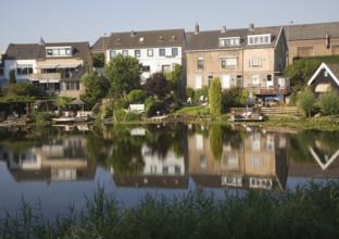 Detached suburban houses in village of Kinderdijk Ablasserdam, near Rotterdam, Netherlands