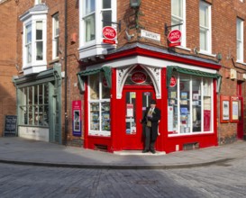 Post Office corner shop painted bright red, Eastgate, Bailgate, Uphill area of city of Lincoln,