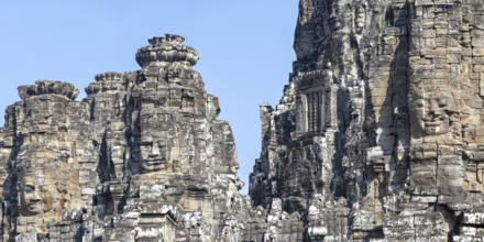 Panoramic image of giant stone-carved faces of the Bodhisattva Lokeshvara, also known as