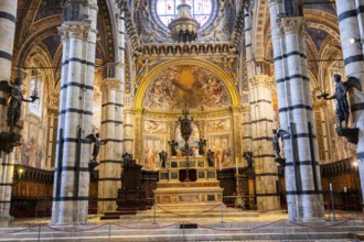 Interior with striped columns and decorated ceiling, Siena Cathedral or Cattedrale di Santa Maria