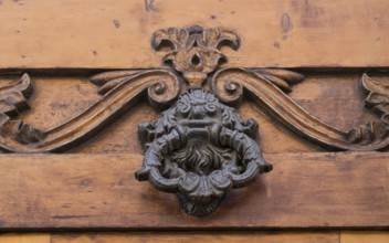 Door knocker on an old wooden door, Ostuni, Apulia, Italy, Europe