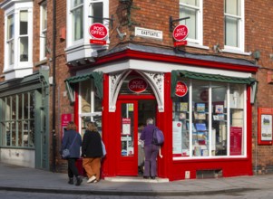 Post Office corner shop painted bright red, Eastgate, Bailgate, Uphill area of city of Lincoln,