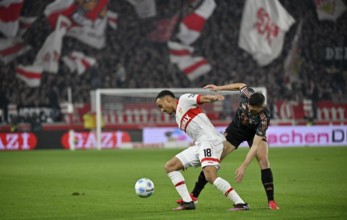 Duel, action Jamie Leweling VfB Stuttgart (18) against Joao Palhinha FC Bayern Munich FCB (16)