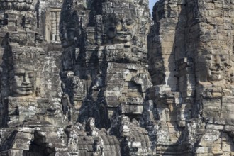 Panoramic image of giant stone-carved faces of the Bodhisattva Lokeshvara, also known as