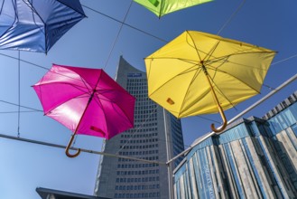 Colourful umbrellas and the MDR high-rise building MDR-Kubus on Augustusplatz, Leipzig, Saxony,