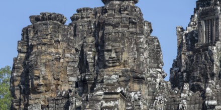 Panoramic image of giant stone-carved faces of the Bodhisattva Lokeshvara, also known as