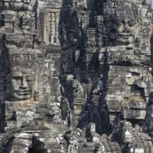 Panoramic image of giant stone-carved faces of the Bodhisattva Lokeshvara, also known as