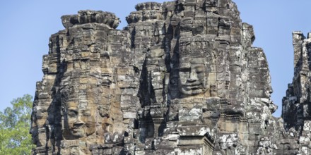 Panoramic image of giant stone-carved faces of the Bodhisattva Lokeshvara, also known as