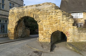 Newport Arch on Ermine Street, Roman entrance gateway to city of Lincoln, Lincolnshire, England, UK