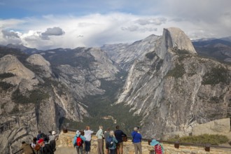 Yosemite National Park, California - Tourists viewing Half Dome in Yosemite National Park from