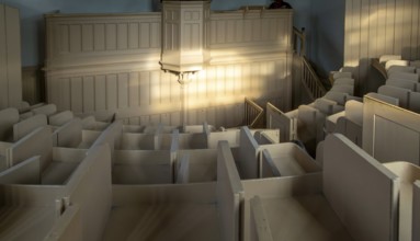 Wooden stalls interior of prison chapel Victorian jail museum, Lincoln Castle, city of Lincoln,