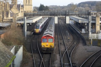 EMR British Rail Class 66 freight train and LNER Class 801 Azuma passenger train, Lincoln railway