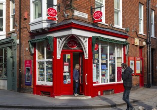 Post Office corner shop painted bright red, Eastgate, Bailgate, Uphill area of city of Lincoln,