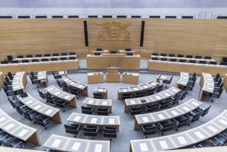 State parliament of Baden-Württemberg. Empty plenary hall, state coat of arms. Stuttgart,