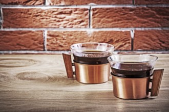 Close up cooffee in vintage copper cups on table