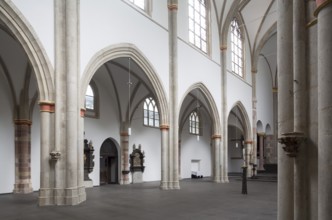 After the renovation without pews, view from the south aisle into the nave