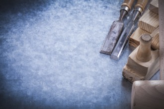 Composition of carpenter's tools on metallic background construction concept