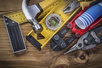 Composition of construction tools on wooden board directly above